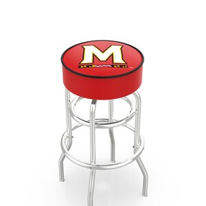 May include: Red bar stool with a chrome frame and a round seat featuring the University of Maryland's logo, a yellow "M" with a black and orange Maryland flag design.