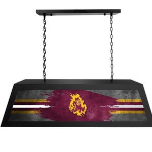 May include: Black pool table light with a distressed, faded, maroon and gold flag design featuring a mascot with a flaming head and a sword. The flag has two white stripes.