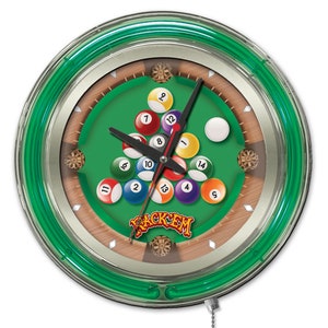 May include: A green neon clock with a pool table design. The clock face features billiard balls arranged in a triangle formation with the numbers 1 through 15. The clock hands are black and the clock face has a silver rim. The clock has a pull chain.