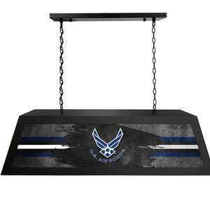 May include: Black pool table light with a distressed gray and blue design featuring the U.S. Air Force logo and the text "U.S. AIR FORCE".