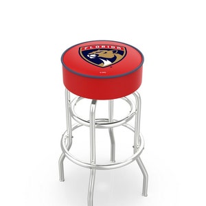 May include: A red bar stool with a chrome frame and a padded seat featuring the Florida Panthers NHL team logo. The logo is a gold and blue shield with a panther head and the words "Florida" above it.