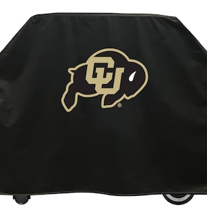 May include: Black grill cover with a gold University of Wyoming logo featuring a buffalo silhouette and the letters "UW".