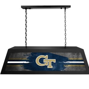 May include: Black rectangular hanging light fixture with a blue and gray background. The light features the letters "GT" in gold. The fixture is suspended by two black chains.