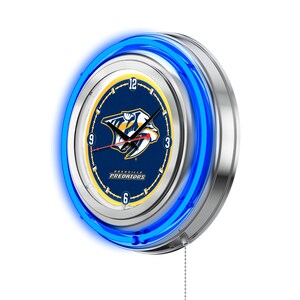 May include: A blue neon clock with a silver frame featuring the Nashville Predators logo. The clock face has a blue background with a yellow outline and the team's logo in the center. The clock hands are black and the numbers are in black and white.