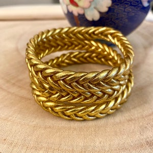 Braided golden Buddhist bangle bracelets