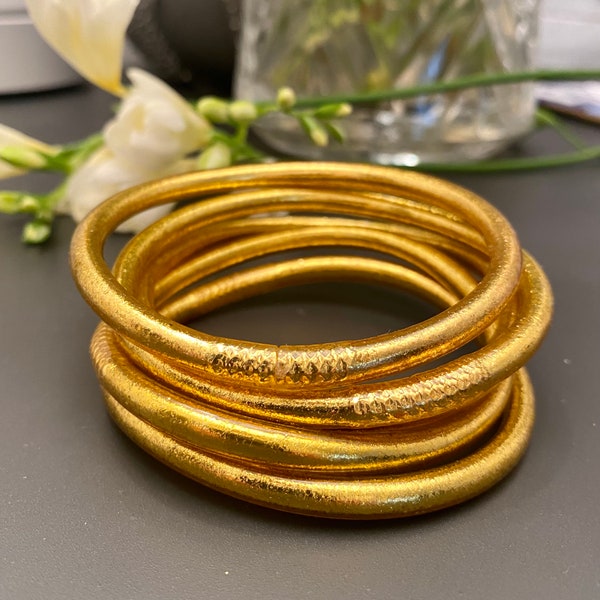 Lot of golden Buddhist bangles