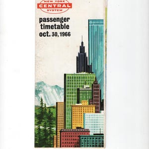 May include: Vintage New York Central System passenger timetable from October 30, 1966. The cover features a colorful illustration of a city skyline with green, brown, and blue buildings, and a mountain range.