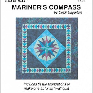 May include: A quilt pattern called "Mariner's Compass" by Cindi Edgerton. The quilt is blue, green, and purple with a compass design in the center. It includes tissue foundations to make a 35 inch by 35 inch wall quilt.