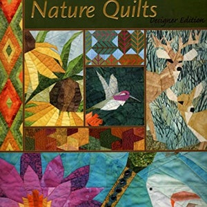 May include: A book cover with the title "Foundation Pieced Nature Quilts: Designer Edition". The cover features a colorful patchwork quilt with images of a hummingbird, a deer, a sunflower, and a water lily.