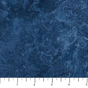 May include: A close-up of a blue textured fabric with a mottled, distressed look. The fabric has a rough, uneven surface and a deep, rich blue color.