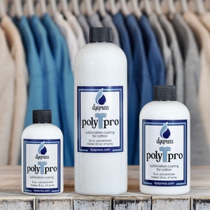 May include: Three bottles of dye press poly pro sublimation coating for cotton. The bottles are white with black caps and blue and white labels. The bottles are labelled with the size of the concentrate and the amount of spray it makes. The bottles are sitting on a wooden surface.