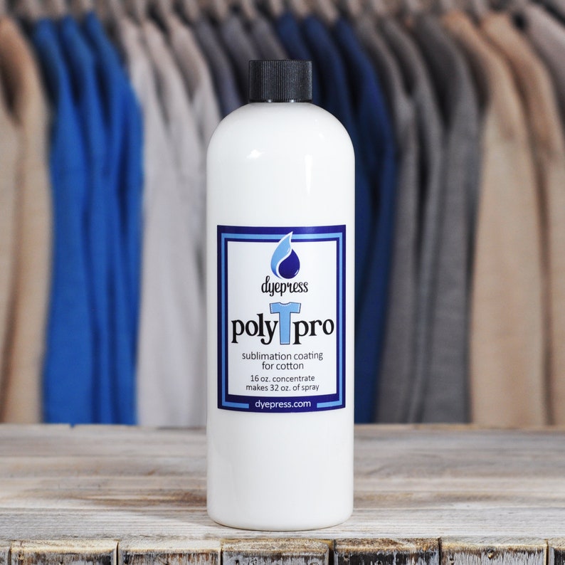 May include: A white bottle of PolyPro sublimation coating for cotton. The bottle is labeled with the brand name "dyepress" and the product name "poly pro". The label also includes the product description, "sublimation coating for cotton", and the size, "16 oz. concentrate makes 32 oz. of spray". The bottle is sitting on a wooden surface.