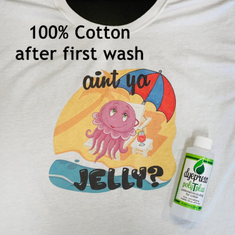 May include: A white t-shirt featuring a pink cartoon jellyfish wearing sunglasses and relaxing on a beach chair under an umbrella. The text "aint ya JELLY?" is printed on the shirt. The shirt is made from 100% cotton and has been washed once. A bottle of dye sublimation ink is also pictured.