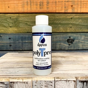 May include: A clear plastic bottle with a white cap and a blue label. The label says "dyepress polyTpro sublimation coating for cotton 4 oz. concentrate makes 8 oz. of spray dyepress.com".