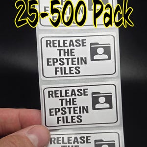 Puede incluir: Una tira de pegatinas rectangulares blancas con texto negro que dice "RELEASE THE EPSTEIN FILES" y un gráfico de una carpeta con un icono de persona. El texto "25-500 Pack" está en la parte superior.