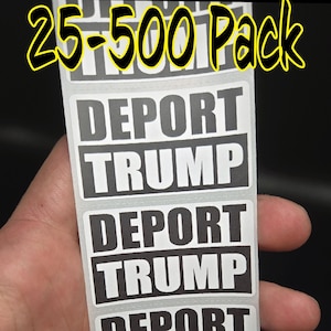 May include: A sheet of black and white stickers with the text "DEPORT TRUMP" repeated five times. The text is in bold, white letters on a black background. The stickers are arranged vertically in a stack. The text "25-500 Pack" is visible at the top of the image.