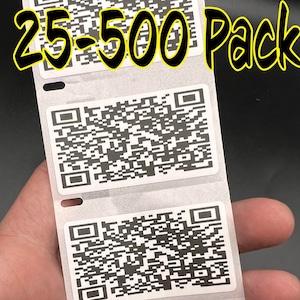 May include: A roll of 25-500 pack white stickers with black QR codes. The stickers are on a white background and have a black border. The text "SlickStick LLC" is printed on the bottom of the roll.