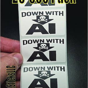 May include: A sheet of white stickers with the text "DOWN WITH AI" and a skull and crossbones symbol. The stickers also feature the text "25-500 Pack" in yellow. The stickers are held by a hand.