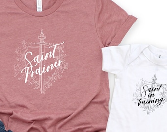 Floral Saint Trainer T Shirt - Catholic Apparel Women - Catholic mother, teacher, homeschool mom gift - Unisex Short Sleeve Tee