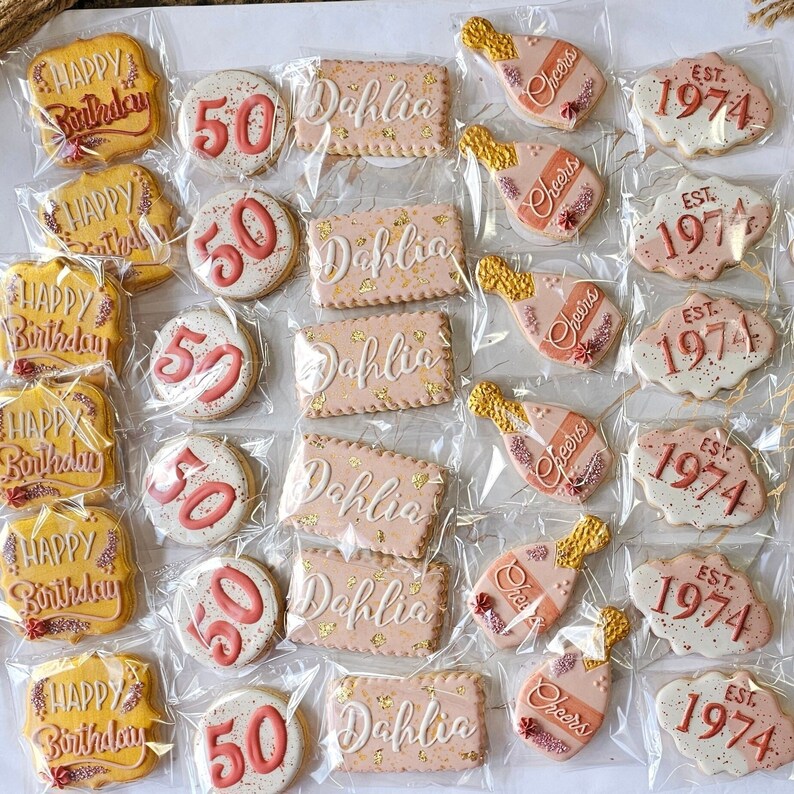 A dozen handmade sugar cookies ready to give as a 50th birthday gift. Choose the name, message, color and design you want for your party. image 2