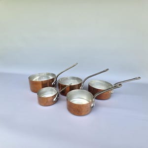 Set of five vintage French copper pots / pans / saucepans with cast iron handles ++
