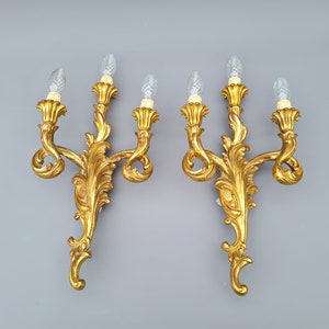 Pair of gilt resin wall lamps, Louis XV style, 1960's  ++