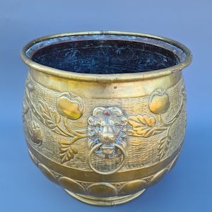 A 19th century French large brass flower / pot / planter jardiniere with lion heads ++