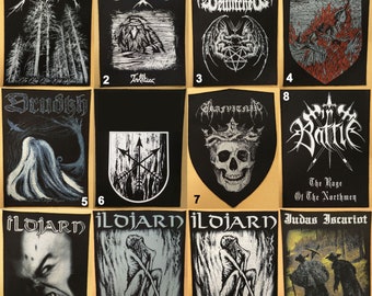 May include: Twelve black and white embroidered patches with band logos. The patches feature various designs, including skulls, swords, and trees. The patches are all rectangular and have a black background.