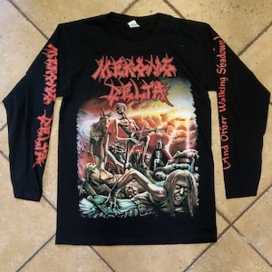 May include: Black long-sleeve t-shirt with a graphic print of a skeletal figure playing a guitar in front of a fiery background. The text "MORKBORG DELTA" is printed in red on the front of the shirt. The text "(And Other Walking Shadows)" is printed in red on the right sleeve.