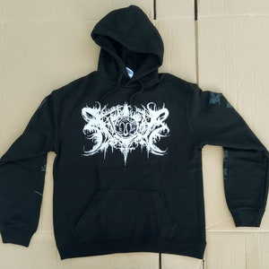 May include: Black hooded sweatshirt with a white graphic print of a stylized logo with the text "SOULFIRE".