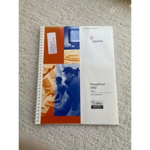May include: A student manual for Microsoft PowerPoint 2002, Level 1, by Lori J. Minnichan. The cover features a group of people working on computers in a classroom setting. The manual is for Microsoft Office Specialist.