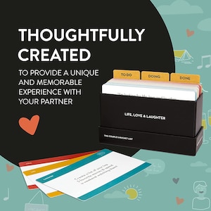 May include: A black box with the words "Life, Love & Laughter" and "The Couple's Bucket List" printed on it. The box contains a set of cards with prompts for couples to complete together. The cards are divided into three categories: "To Do", "Doing", and "Done".