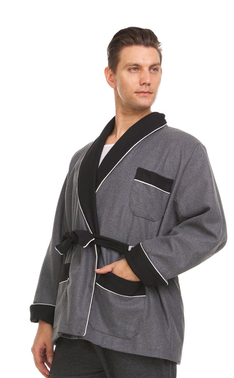 May include: A gray robe with black trim and a white piping detail. The robe has a shawl collar, a tie belt, and two pockets.