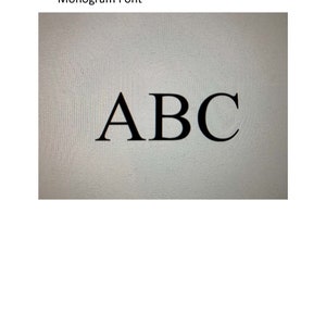 May include: A close-up of the letters A, B, and C in a black, serif font on a white background. The text "Monogram Font" is above the letters.