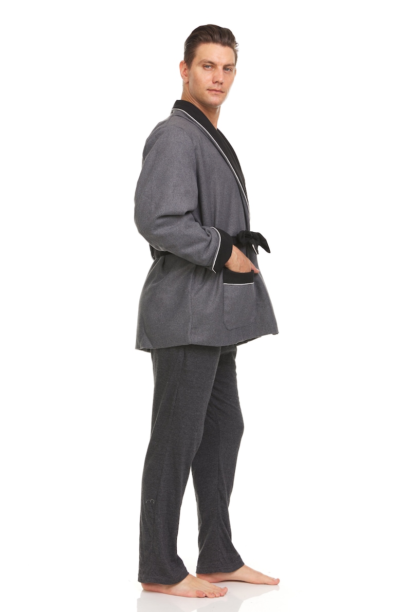 May include: A gray robe with black trim and a white piping detail. The robe has a sash tie and a patch pocket on the left side.