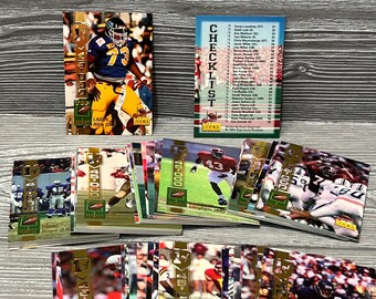 May include: A collection of 1994 NFL football trading cards featuring rookie players. The cards are in a variety of colors, including gold, green, and white. The cards feature photos of the players, their names, and their team logos. The cards are in good condition and are a great addition to any football fan's collection.