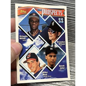 May include: A 1994 Topps baseball card featuring four baseball players in diamond-shaped portraits. The card includes the text "PROSPECTS" and the names Orlando Miller, Brandon Wilson, Mike Neal, and Derek Jeter.