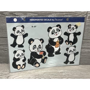 May include: A sheet of handpainted panda bear decals. The pandas are black and white with various poses, some holding honey pots or food. The sheet has the text "HANDPAINTED DECALS by Decorcal" and the number "B-37".