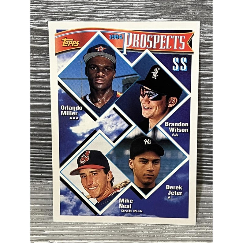 May include: A 1994 Topps baseball card featuring four baseball prospects. The card has a blue background with diamond-shaped portraits of Orlando Miller, Brandon Wilson, Mike Neal, and Derek Jeter. The Topps logo is in the upper left corner.