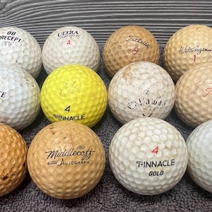One Dozen Assorted Vintage Golf Balls