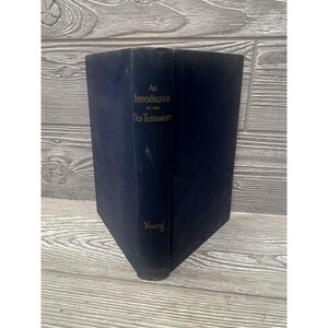 May include: A dark blue hardcover book titled An Introduction to the Old Testament by Young. The book is positioned vertically, displaying the spine with gold lettering against the solid dark blue fabric cover material of the book's exterior.