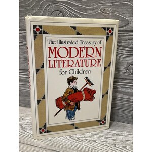 May include: A hardcover book titled The Illustrated Treasury of Modern Literature for Children. The white cover features a gold geometric border with red accents and an illustration of a child carrying a red rolled rug and a broom.