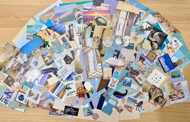 May include: A collection of assorted paper ephemera with a coastal theme, including images of beaches, seashells, and marine life. The collage features various textures and colors, with a central gift bag tied with twine.