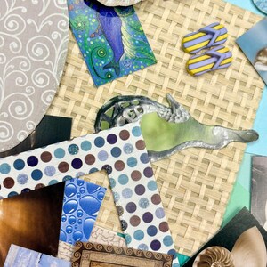 May include: A collage of beach-themed elements. Includes a seashell, a mermaid illustration, miniature yellow and purple flip-flops, and various patterned paper cutouts. The color palette features blues, greens, and neutral tones, evoking a coastal aesthetic.