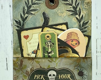 May include: A vintage-style Halloween tag with a pocket and a skull and crossbones design. The tag reads "Pick Your Poison Special Brew".