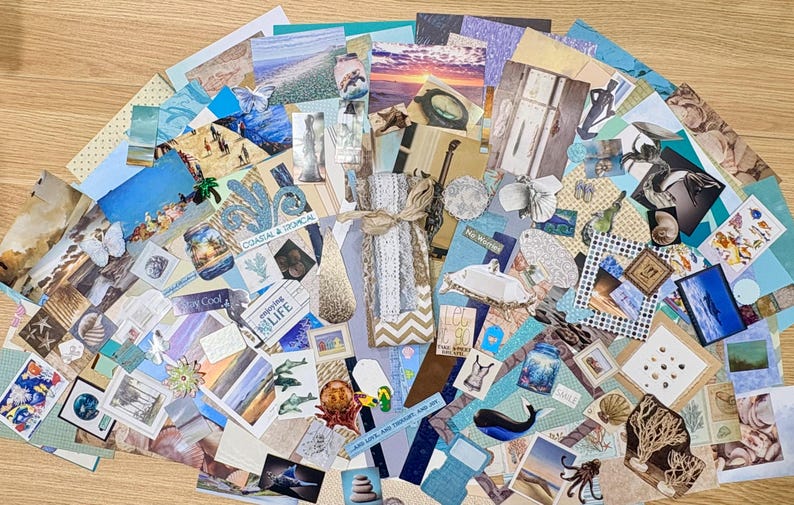 May include: A collection of assorted paper ephemera with a coastal and tropical theme. The collage includes images of beaches, seashells, and marine life, with various shades of blue, beige, and white. Some pieces have text, and the arrangement is fanned out.