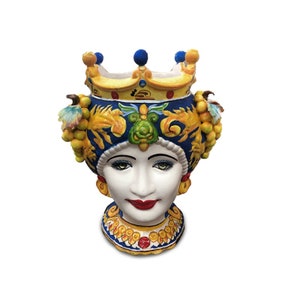 May include: A ceramic planter shaped like a woman's head with a crown and yellow fruit accents. The planter is painted in blue, yellow, green, and red.