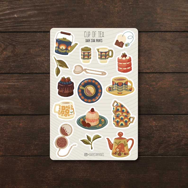 May include: A sheet of stickers featuring a variety of tea-themed illustrations, including teapots, cups, tea bags, cakes, and tea leaves. The stickers are in a retro style with colourful patterns and designs. The text "CUP OF TEA DARK STAR PRINTS" is at the top of the sheet.