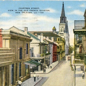 May include: Vintage postcard depicting Chartres Street in the French Quarter of New Orleans. The image shows a street lined with buildings, a church steeple, and the text "CHARTRES STREET, VIEW IN THE OLD FRENCH QUARTER, NEW ORLEANS, LA.-101".