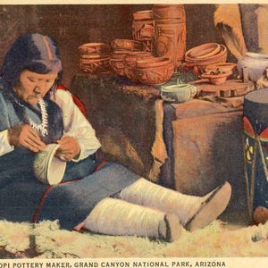 May include: Vintage postcard depicting a Hopi pottery maker in Grand Canyon National Park, Arizona. The image shows a person crafting pottery, surrounded by finished pieces and a drum. The scene is rich in cultural detail and historical context.